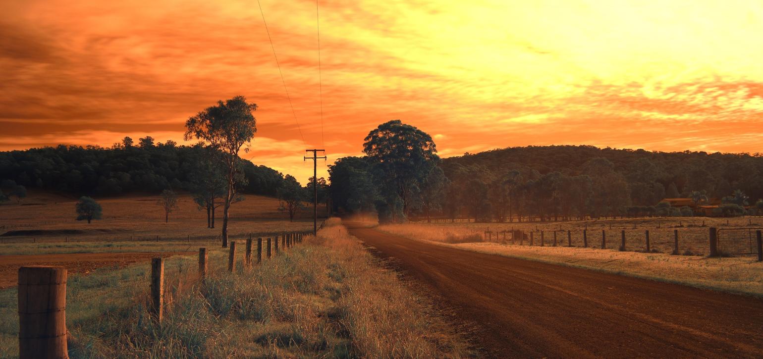 regional town road at sunset