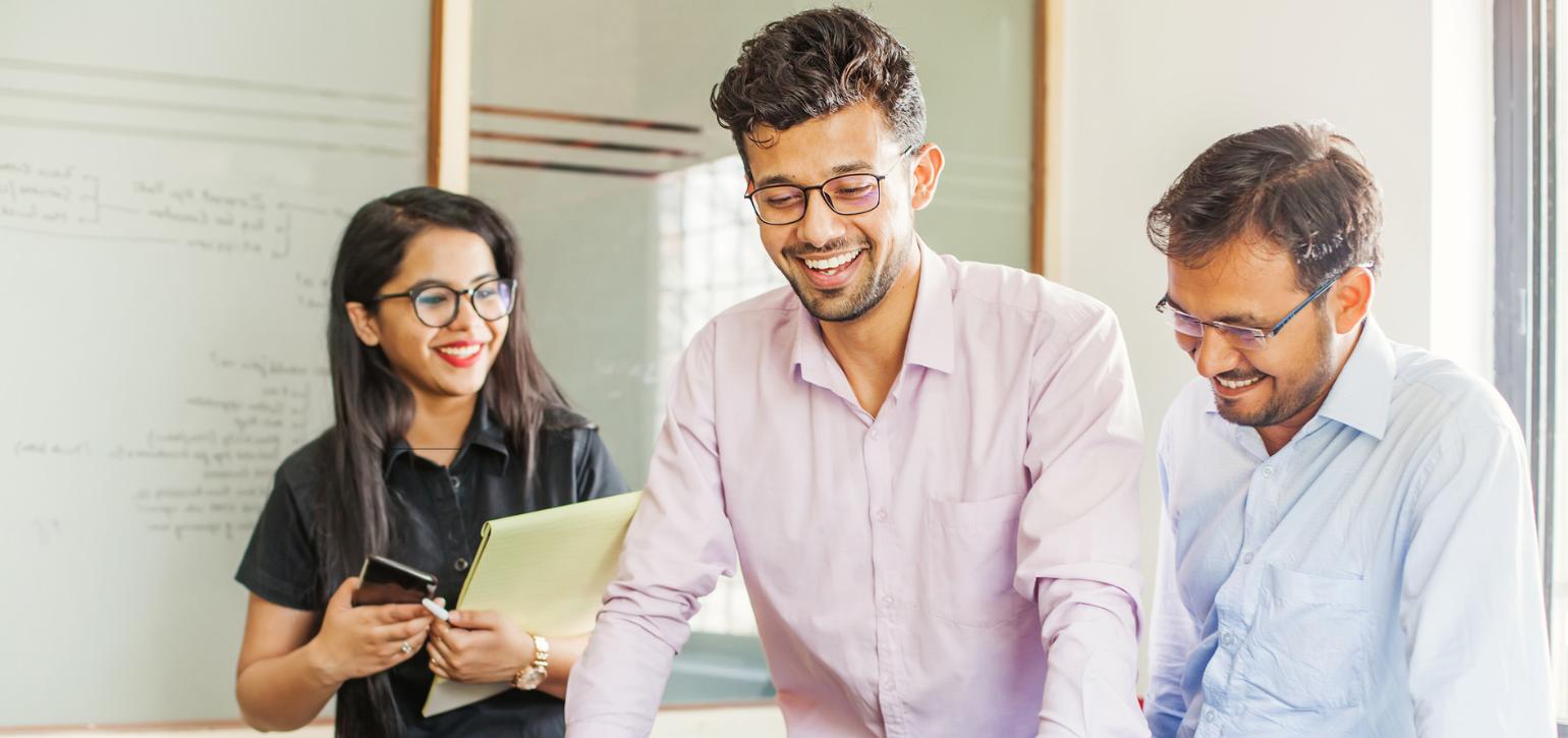 Indian origin people around a table at work