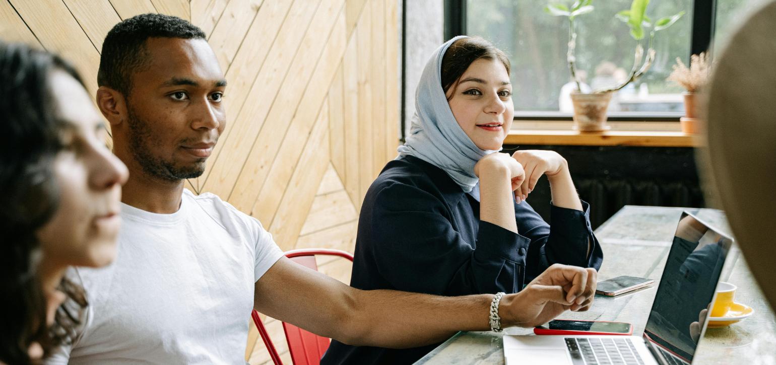 Arabic speaking students sitting around a table