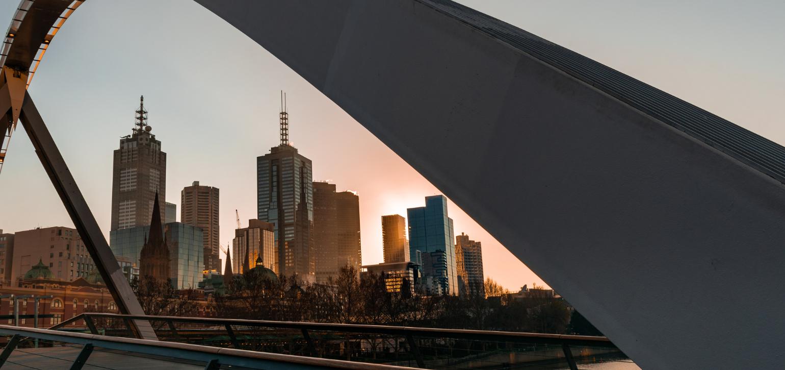 Melbourne skyline photographed from a curving bridge