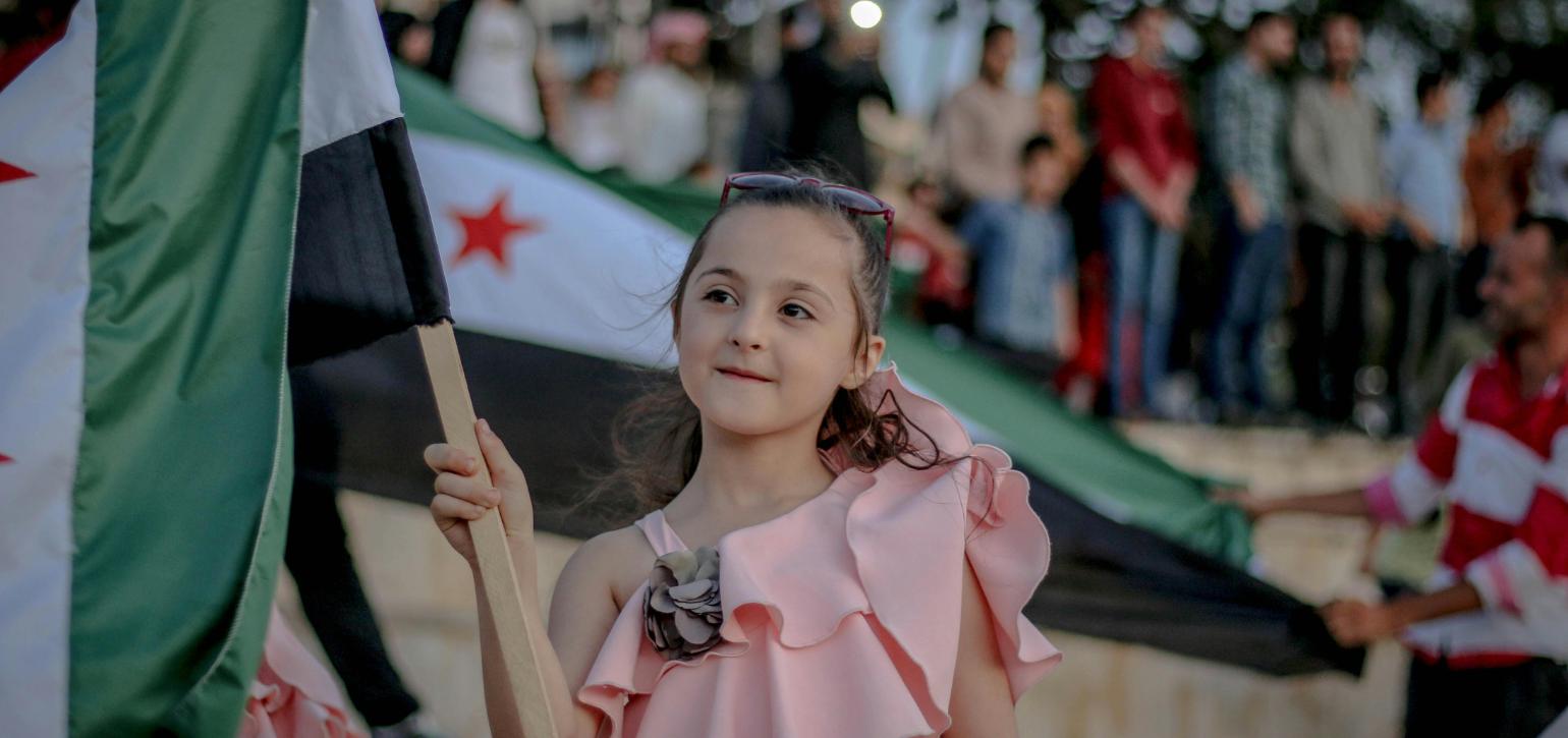 Young Syrian girl with flag