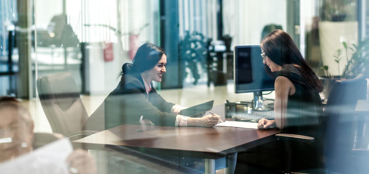 Corporate employees in an office meeting room