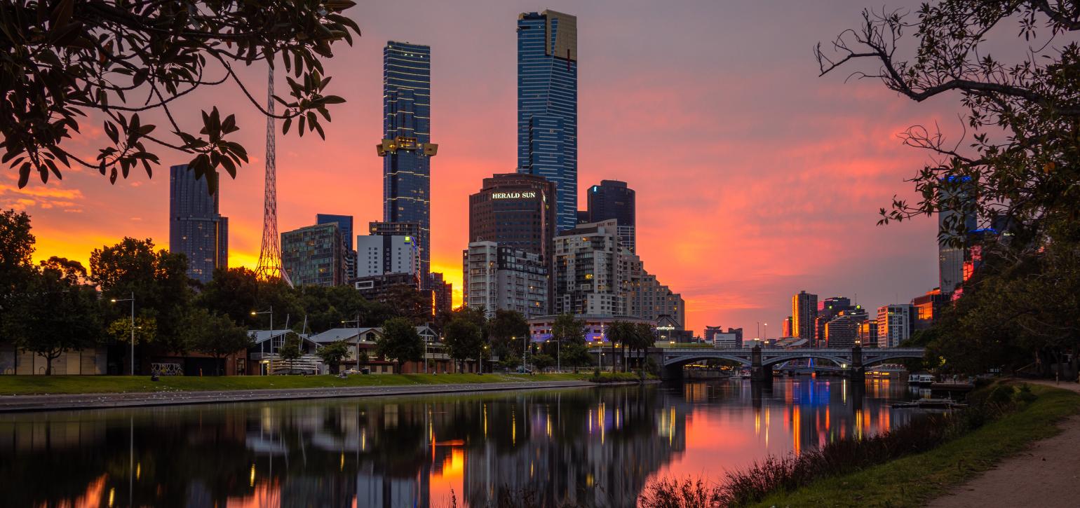 buildings and river at sunset