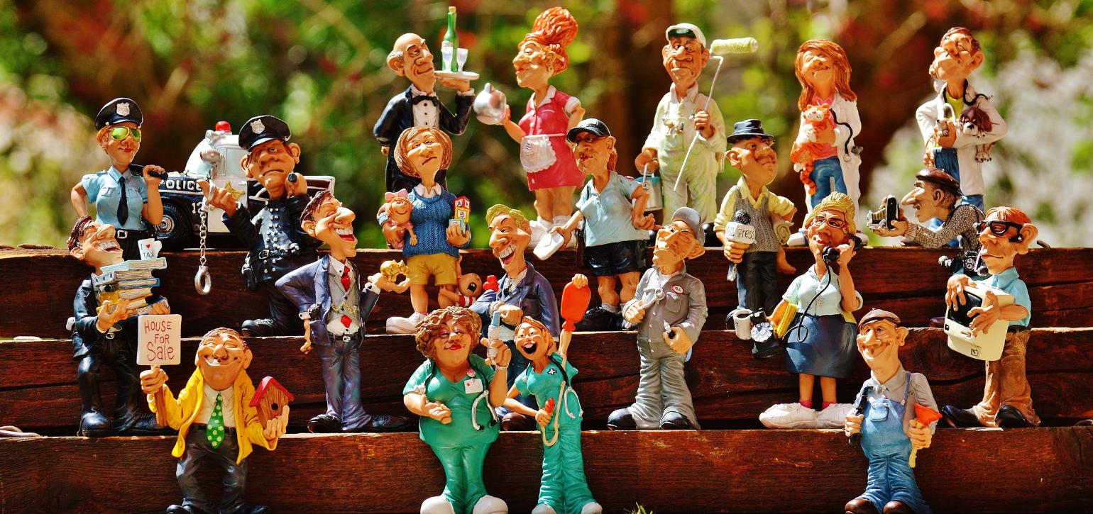 caricatures sitting on bleacher seats