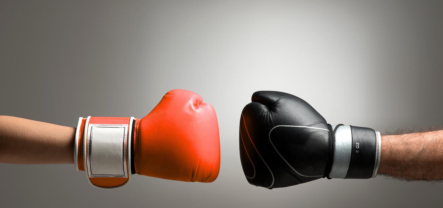 boxing gloves facing off
