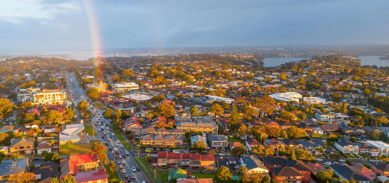 Sydney suburbs aerial view with rainbow