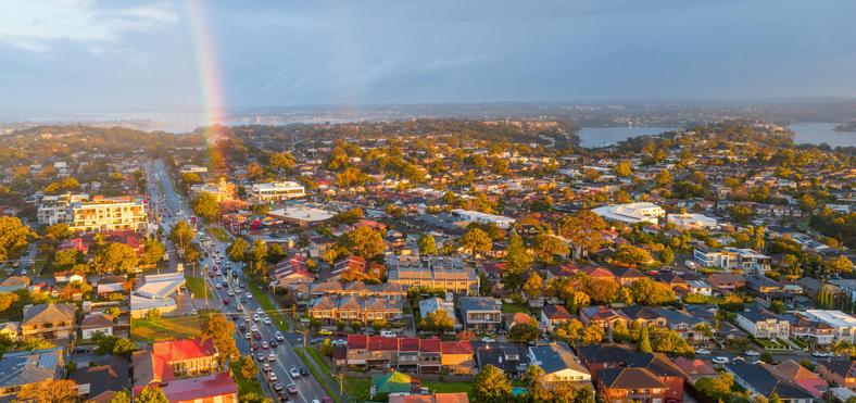 Sydney suburbs aerial view with rainbow