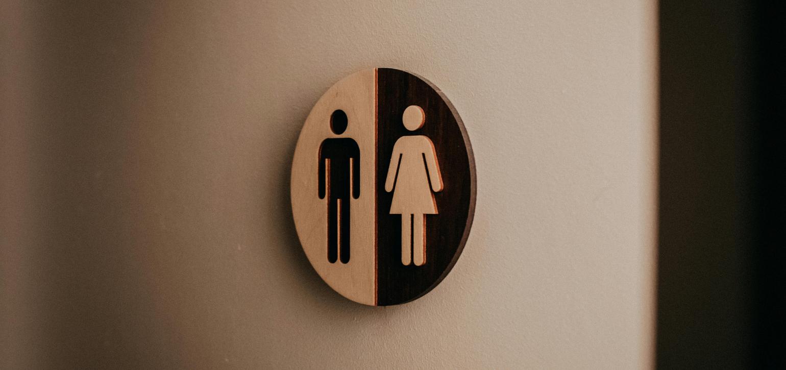 toilet door sign showing man and woman figures