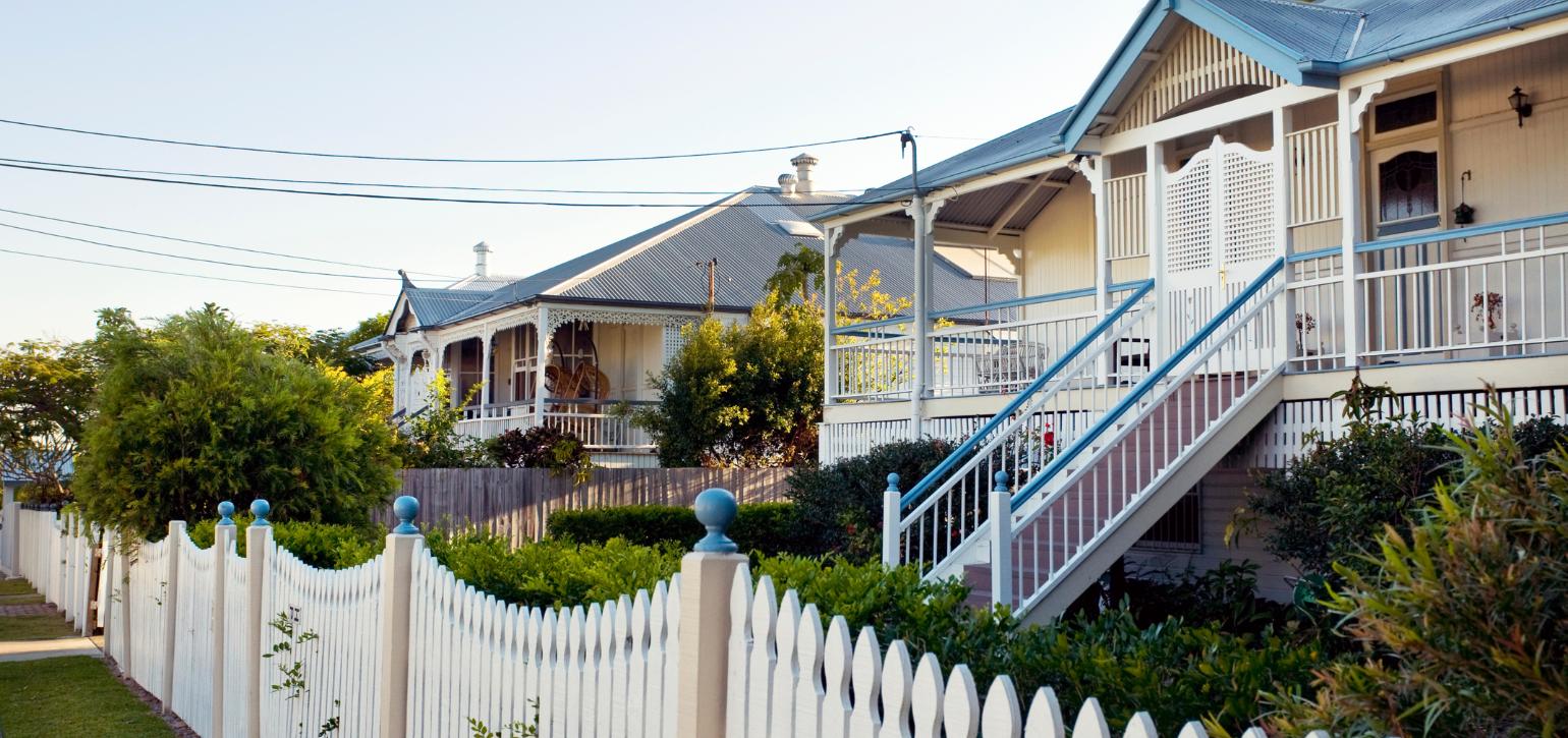 subruban houses with white picket fence