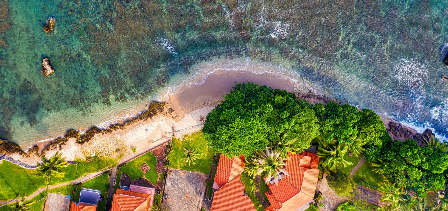 aerial view coastal homes by sea