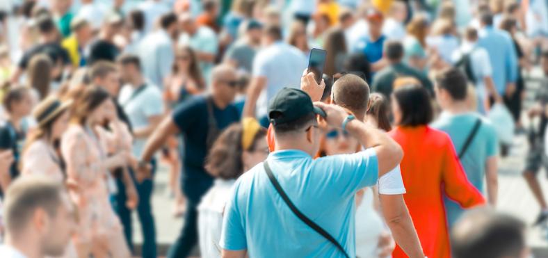 Group of people walking in a crowd