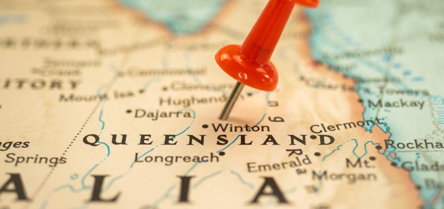 map of Australia with a red pin in Queensland