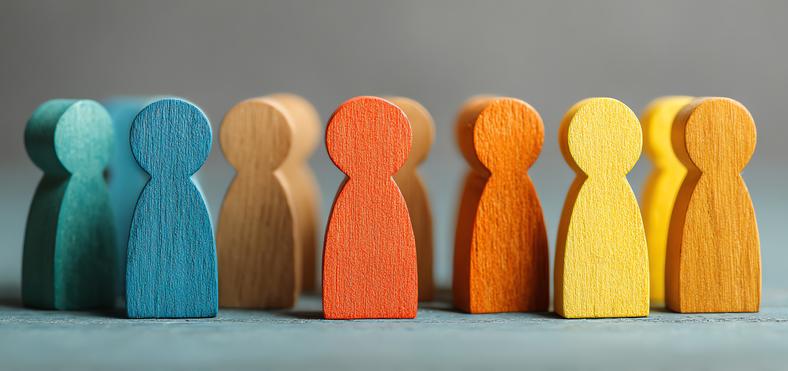 colourful wooden figurines shaped like people
