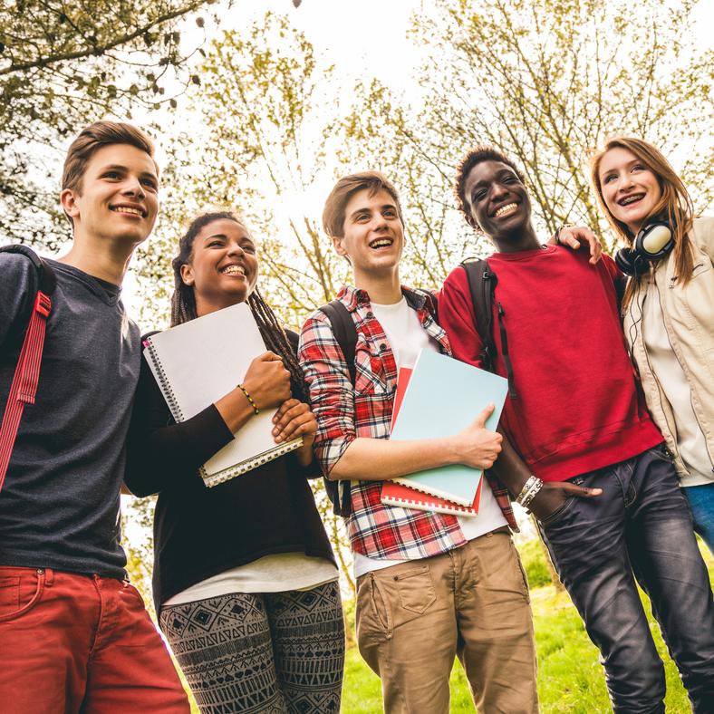 students in a group smiling
