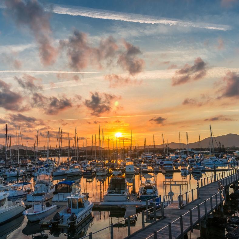 coffs harbour at sunset with boats