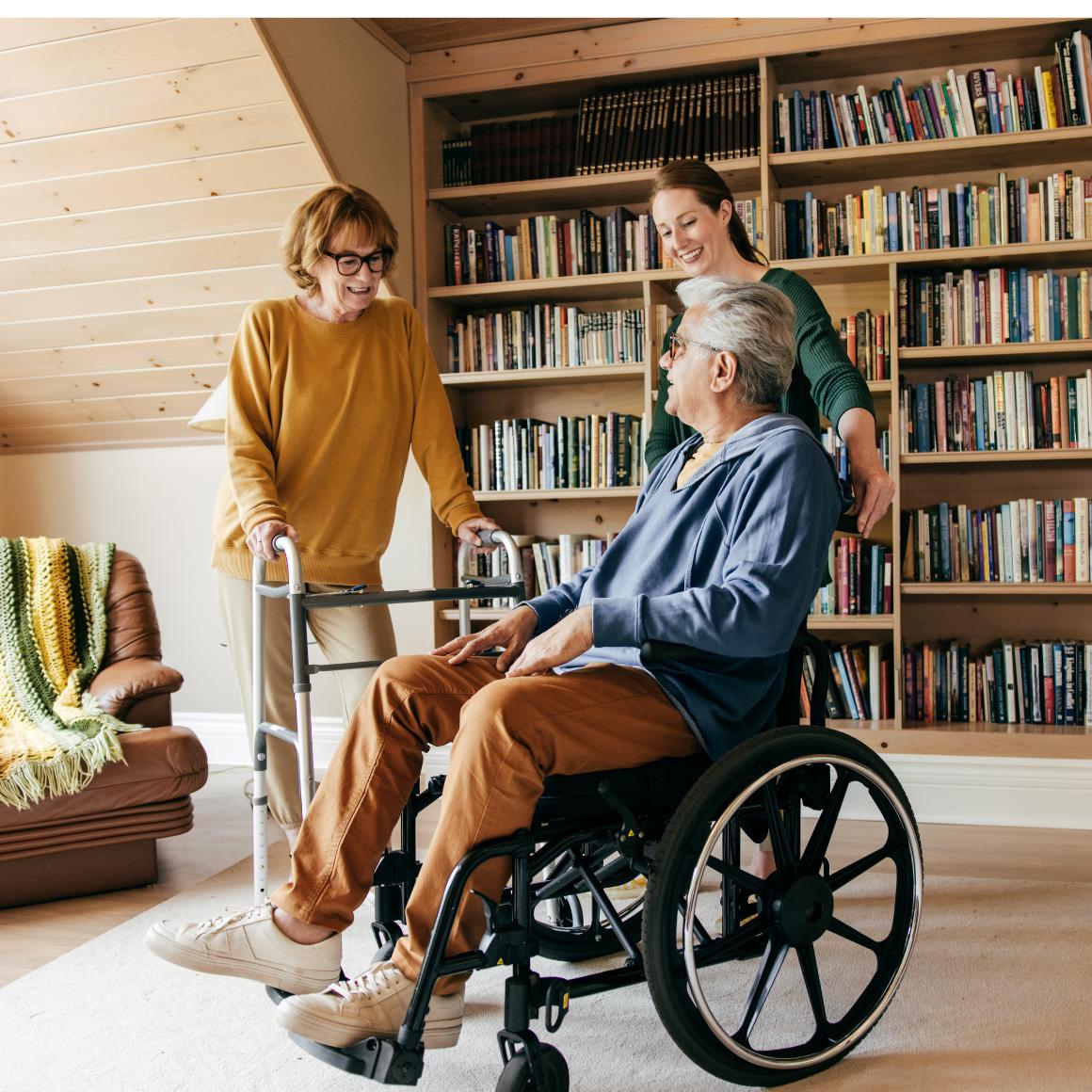 A group of people in a library, using wheelchairs and walkers.